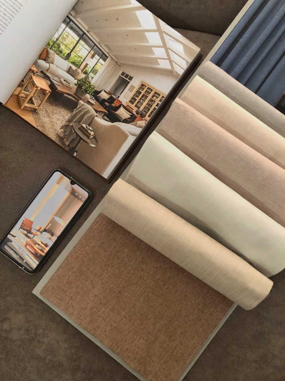 fabric with mobile phone displaying interior design photo