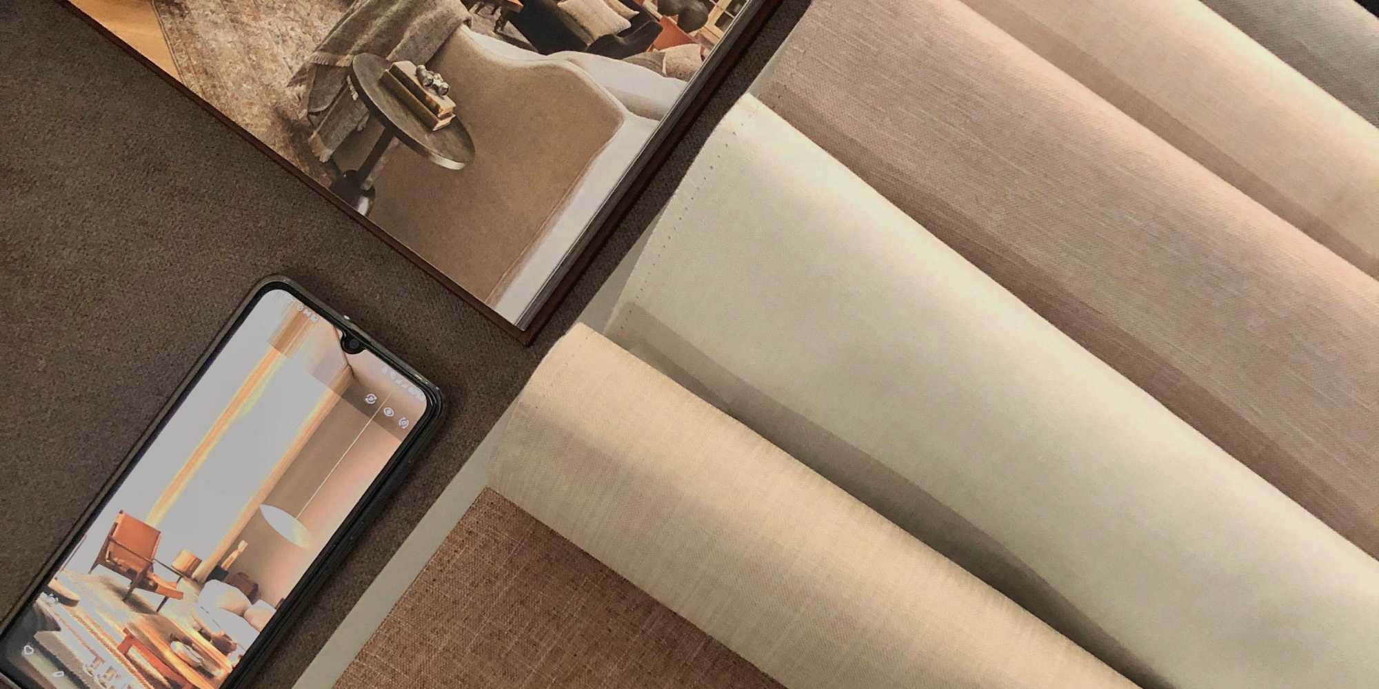 fabric with mobile phone displaying interior design photo